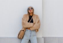 Stylish teen wearing a faux-fur jacket and crop top in winter street style