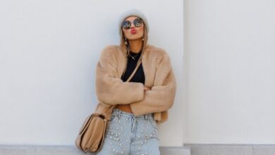 Stylish teen wearing a faux-fur jacket and crop top in winter street style