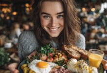 Teen girl smiling while holding a plate of balanced food representing healthy teen eating habits