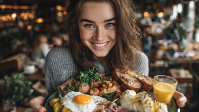 Teen girl smiling while holding a plate of balanced food representing healthy teen eating habits