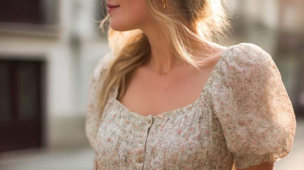 Close-up of a floral babydoll top with square neckline and puff sleeves