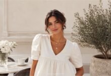 Woman wearing a white babydoll top in a fresh polished summer outfit