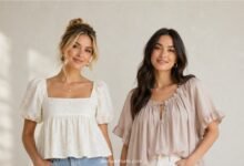 Two women wearing babydoll and smock tops in a clean horizontal fashion comparison portrait
