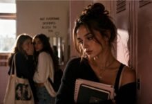 Draining friend cover with sad teenage girl by school lockers while two girls whisper behind her in an emotional friendship drama scene