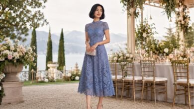 Blue lace wedding guest dress styled with refined accessories for a romantic garden celebration by the lake