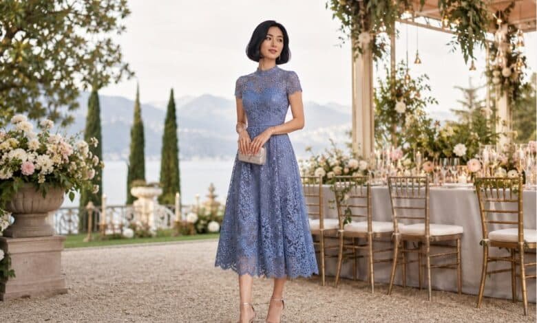 Blue lace wedding guest dress styled with refined accessories for a romantic garden celebration by the lake