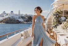 March wedding guest dress on a luxury yacht in Greece with a pale blue halter dress and seaside wedding reception
