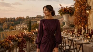 October wedding guest dress in plum with long sleeves at an autumn vineyard terrace wedding