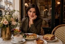 Stylish woman at a European café with quiche, croque monsieur, pastel de nata, cappuccino, fruit and flowers