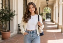 Cute real school outfit with a white fitted top, cream cardigan, relaxed jeans, shoulder bag and simple jewelry for effortless teen style.