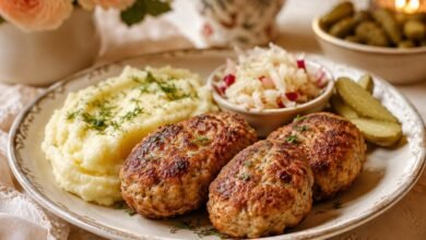 Russian cutlets with creamy potatoes, cabbage salad and pickles for a cozy Eastern European comfort food dinner