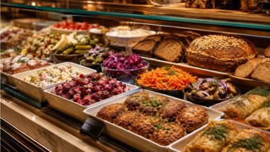 Russian deli prepared food counter with kotleti, salads, rye bread, pickles and Eastern European takeout comfort food
