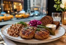 Russian kotleti dinner in New York City with buckwheat, pickles, cabbage, rye bread and classic Eastern European sides