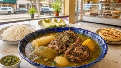 Colombian oxtail sancocho with yuca, green plantain, corn, rice and avocado in a bright New Jersey Colombian restaurant