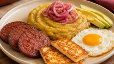 What Is Los Tres Golpes? Inside the Iconic Dominican Breakfast 7 Los Tres Golpes Dominican breakfast with mangú fried salami queso frito egg and red onions